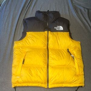 black and yellow/gold medium the north face puff vest with hood